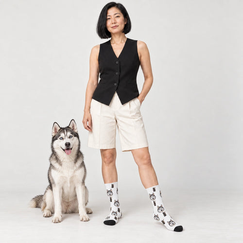 Hooded Skeleton Dog Face Socks in White, Crew Socks modeled with a dog
